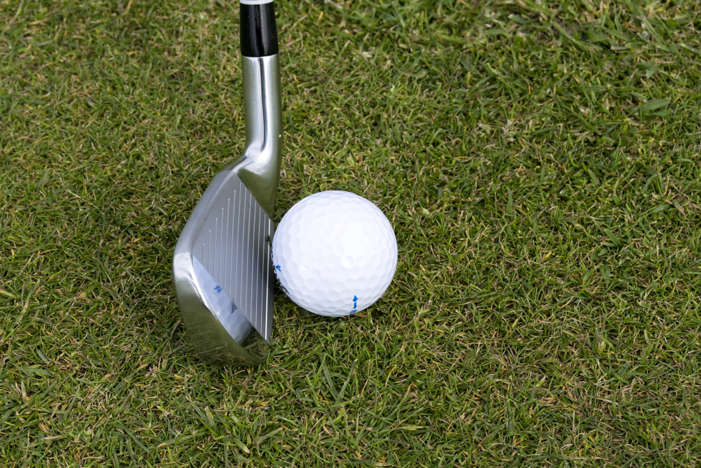 golf ball near golf club